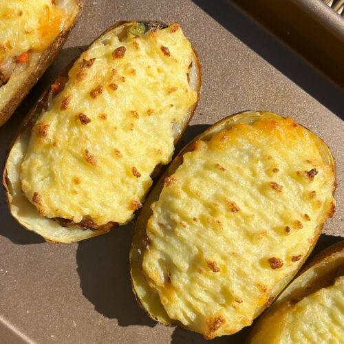 Cottage pie potatoes with a brown background